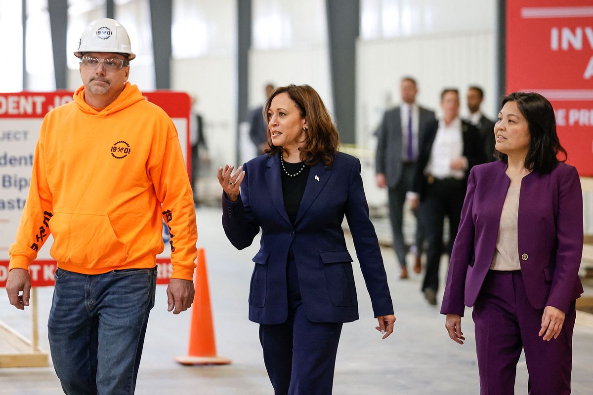 US Vice President Kamala Harris (C), joined by acting Labor Secretary Julie Su (R), visit the construction site of the Madison Metro Transit facility, on March 6, 2024, before Harris speaks about the Biden administration's efforts to promote union job growth and expand apprenticeship programs in Madison, Wisconsin, on March 6, 2024. (KAMIL KRZACZYNSKI/AFP via Getty Images)