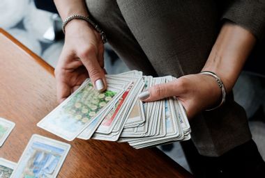 Woman holding tarot cards