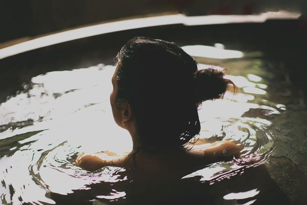 Woman bathing in a hot spring